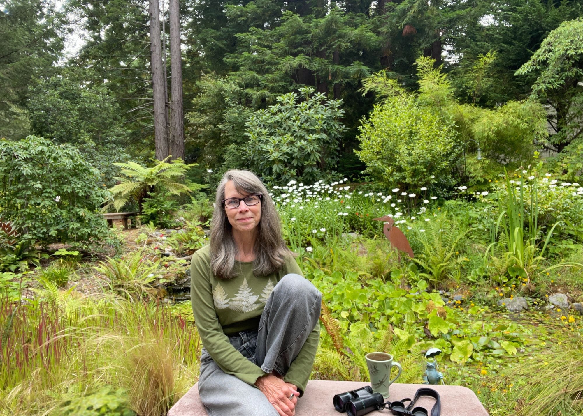 photo of Kimberley Pittman-Schulz in wild setting of pond and nature