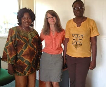 Photo of author flanked by two ChildFund Liberia program specialists.