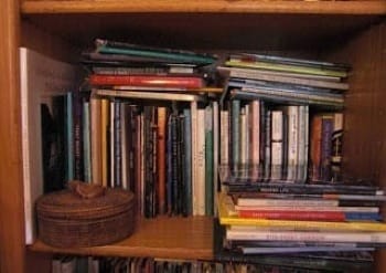 Photo of busy bookshelf in author's room
