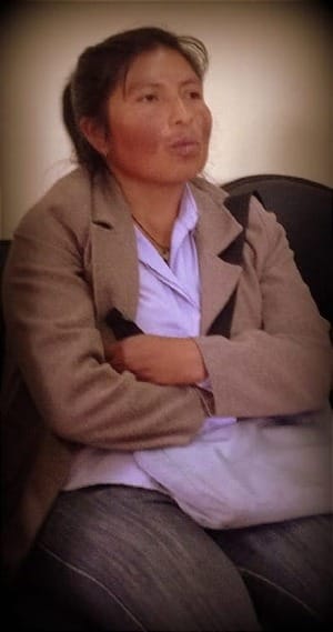 Photo of Ecuadorian mother waiting to speak.