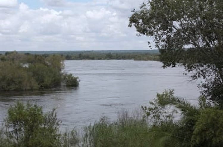 Photo of a stretch of the Zambezi River in 2010 rising out of its banks.
