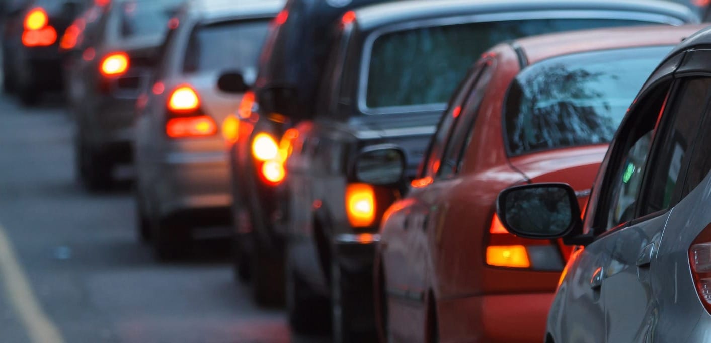 Photo of bumper-to-bumper traffic--cars with break lights on and stopped